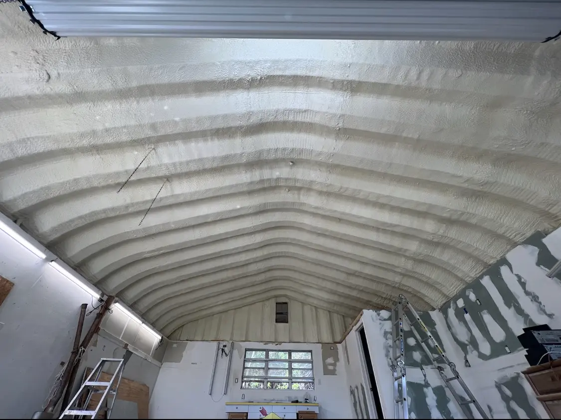 Spray polyurethane foam applied to the underside of a metal roof deck in Kingsland
